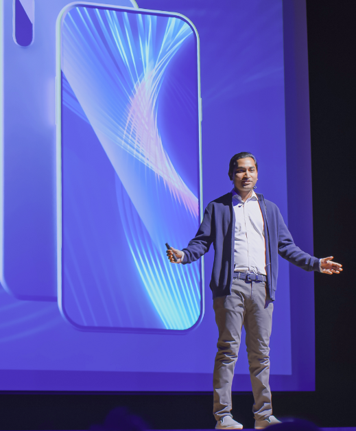 Male speaker in front of screen