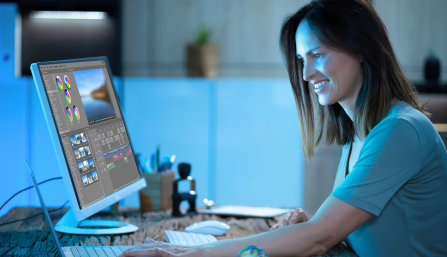 Woman editing a video at desktop computer