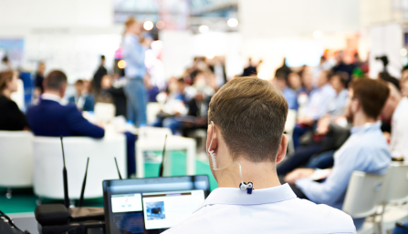 Audio Technician at a live event managing interpretation stream