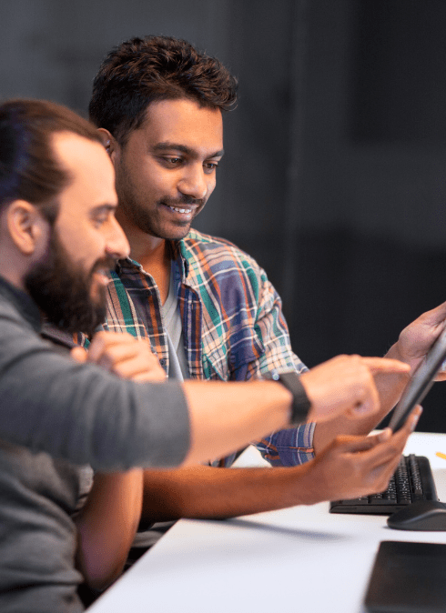 Male colleagues working on tablet