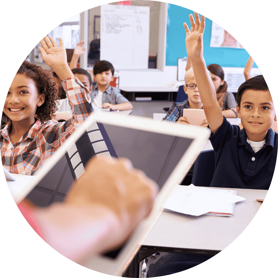 Students raising hands in the classroom 