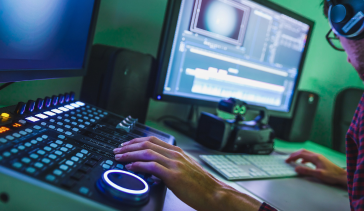 Man working in front of editing console